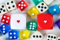 Two red and white Valentines Day dice among others Royalty Free Stock Photo