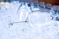 Two red wine crystal glasses lay on a raw of other grasses prepared for big party. Blurred. Catering and restaurant Royalty Free Stock Photo