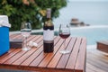 Two Red wines glasses near swimming pool. Summer travel, vacation, holiday and happy weekend concept