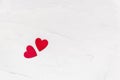 Two red wooden hearts on textured concrete background from above. Love and togetherness concept. Valentines Day. Flat lay with Royalty Free Stock Photo