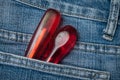 two red wooden turn in blue jeans pocket Royalty Free Stock Photo