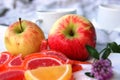 Two red yellow Apples, colorful Apple marmalade slices and flower of the clover. mini picnic in the Park