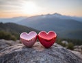 two redish hearts on the top of a mountain at the sunset Royalty Free Stock Photo