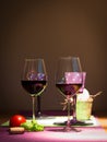 Two redwine glasses with tomato and basil