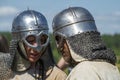 Two reenactors in Norman type helmets close-up