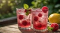 Refreshing Raspberry Lemonade Summer Drink with Ice Cubes and Mint Garnish Royalty Free Stock Photo