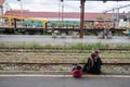 Two refugees, a woman, mother, and her daughter, waiting for a train in Belgrade train station on the Balkans Route Royalty Free Stock Photo