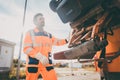 Two refuse collection workers loading garbage into waste truck Royalty Free Stock Photo