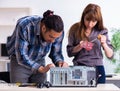 Two repairmen repairing desktop computer Royalty Free Stock Photo
