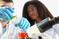 Two researchers are conducting experiments with chemical liquid in laboratory Royalty Free Stock Photo