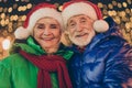 Two retired pensioner grey white hair people affectionate couple woman man celebrate x-mas christmas jolly event walk