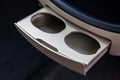 Retractable cup holders for drinks, tea or coffee on the car panel Royalty Free Stock Photo