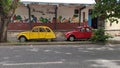 19.03.2023 Two retro cars of the French brand Citroen 2CV red and yellow in Lisbon Royalty Free Stock Photo