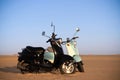 Two scooters at sunset in the golden sand of the Namib Desert Royalty Free Stock Photo