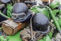 Two retro vintage style protective helmet on military bike Royalty Free Stock Photo