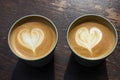 Two reusable return cups with cappuccino coffee Royalty Free Stock Photo