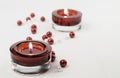 Two rich red candle holder votive and pearls Royalty Free Stock Photo