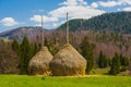 Two Ricks of hay in mountain