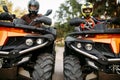 Two riders on quad bikes, front view, closeup Royalty Free Stock Photo