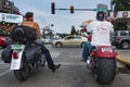 Two riders stopped at a red light in thecity of Sturgis, in South Dakota, USA, during the annual Sturgis Motorcycle Rally