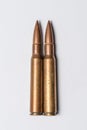 Two rifle bullets on white background Royalty Free Stock Photo