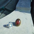 Two rings different motif germ stone called lunar moon and two lotus at rooftop under sunrise in the morning