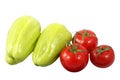 Two ripe bell pepper and three red tomatoes isolated on a white background Royalty Free Stock Photo