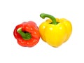 Two ripe bell peppers, one red and one yellow with green stem isolated on white background Royalty Free Stock Photo