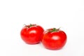 Two ripe fresh red tomatoes isolated on white background