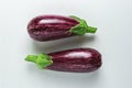 Two ripe graffiti eggplants isolated on a white background. Food concept Royalty Free Stock Photo