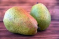 Two ripe pears on an old wooden table. Royalty Free Stock Photo