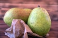 Two ripe pears on an old wooden table. Royalty Free Stock Photo