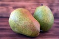 Two ripe pears on an old wooden table. Royalty Free Stock Photo