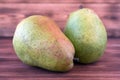 Two ripe pears on an old wooden table. Royalty Free Stock Photo