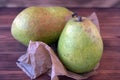 Two ripe pears on an old wooden table. Royalty Free Stock Photo