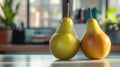 Two ripe pears on a sunlit kitchen table. Royalty Free Stock Photo
