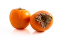Two ripe persimmons isolated Royalty Free Stock Photo