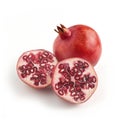 Two ripe pomegranates. one whole one cut in halve showing his in