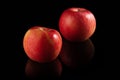 Two ripe red apples