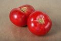 Two ripe tomatos on a parchment Royalty Free Stock Photo