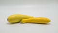 Two yellow summer squash on white Royalty Free Stock Photo