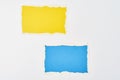 Two ripped color paper torn edge sheets on the white background. Template with piece of color paper Royalty Free Stock Photo