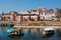 Two river boats floating on the river of asian city