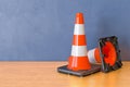 Two Road Cones on the wooden table. 3D rendering