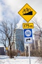 Road Signs along a Bicycle Path on a Sunny Winter Day Royalty Free Stock Photo