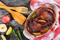 Two roasted duck legs grilled in red wine and apple Royalty Free Stock Photo