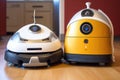 two robot vacuums side by side, comparing different models