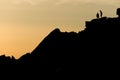 Two rock climbers look back from the summit of stanage edge in england Royalty Free Stock Photo