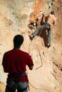 Two rock climbers, one belaying Royalty Free Stock Photo