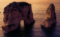 Two rocks in the sea at sunset - Pigeons Rock / Sabah Nassar`s Rock / Raouche in Beirut, Lebanon Royalty Free Stock Photo